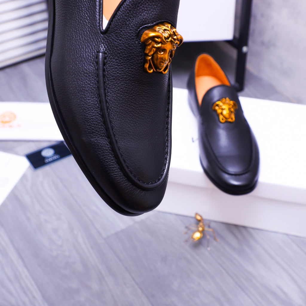 Versace black leather loafer with gold Medusa emblem and orange inner lining detail