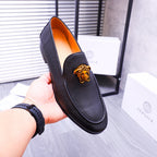 Versace black leather loafer with gold Medusa emblem and orange inner lining