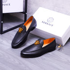 Versace black leather loafers with gold Medusa emblem and orange interior