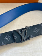 Louis Vuitton monogram belt close-up of dark blue strap and metal buckle