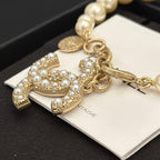 Chanel pearl bracelet with gold-tone horse charm and pearl-like rhinestone details