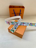 White leather belt with multicolor graffiti strap and gold-tone buckle
