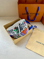 White belt with multicolor patterned band and gold-tone buckle