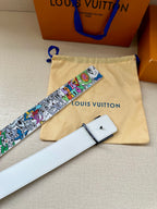 White leather belt with multicolor graffiti strap and buckle; matching pouch