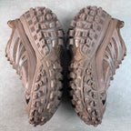 Pair of Balenciaga track shoes showing both outsoles with deep tread and side detailing