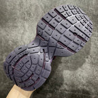 Purple and gray sneakers outsole with textured traction tread pattern