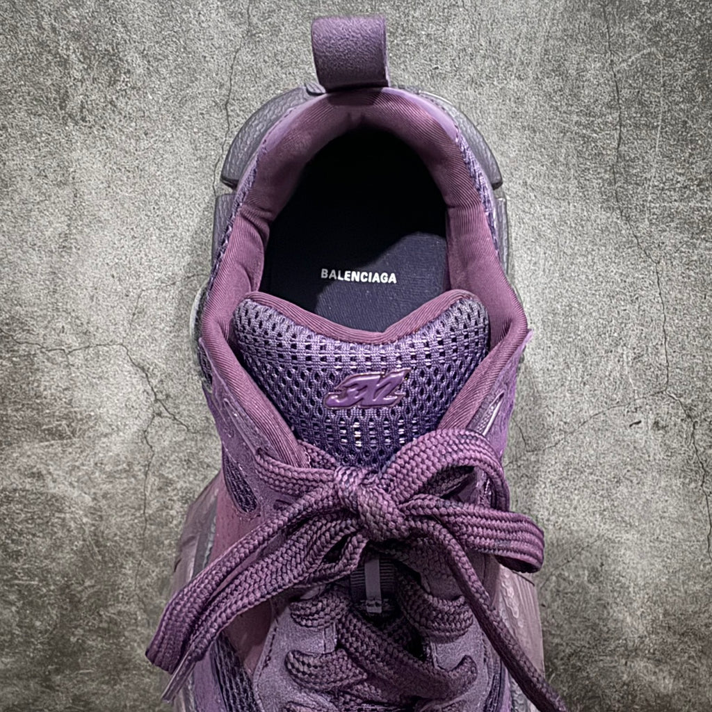 Purple sneakers interior view with Balenciaga logo and lace detail at opening