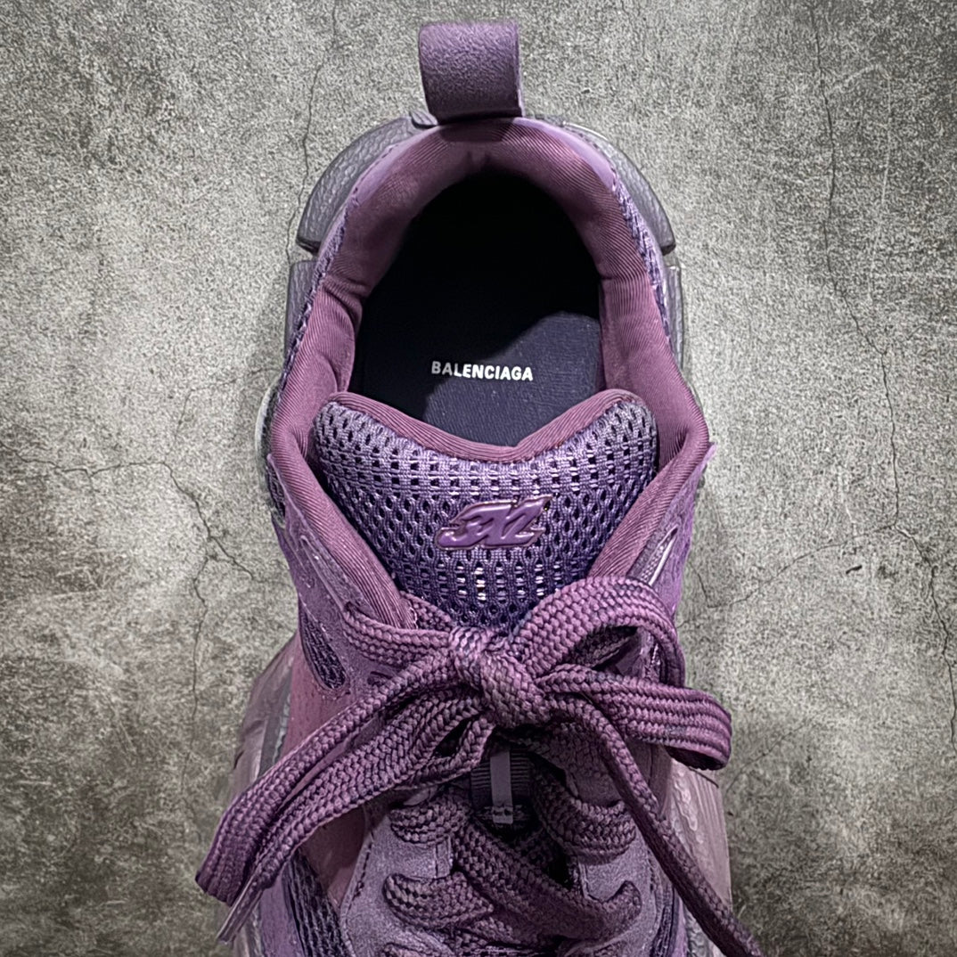 Purple sneakers interior view with Balenciaga logo and lace detail at opening