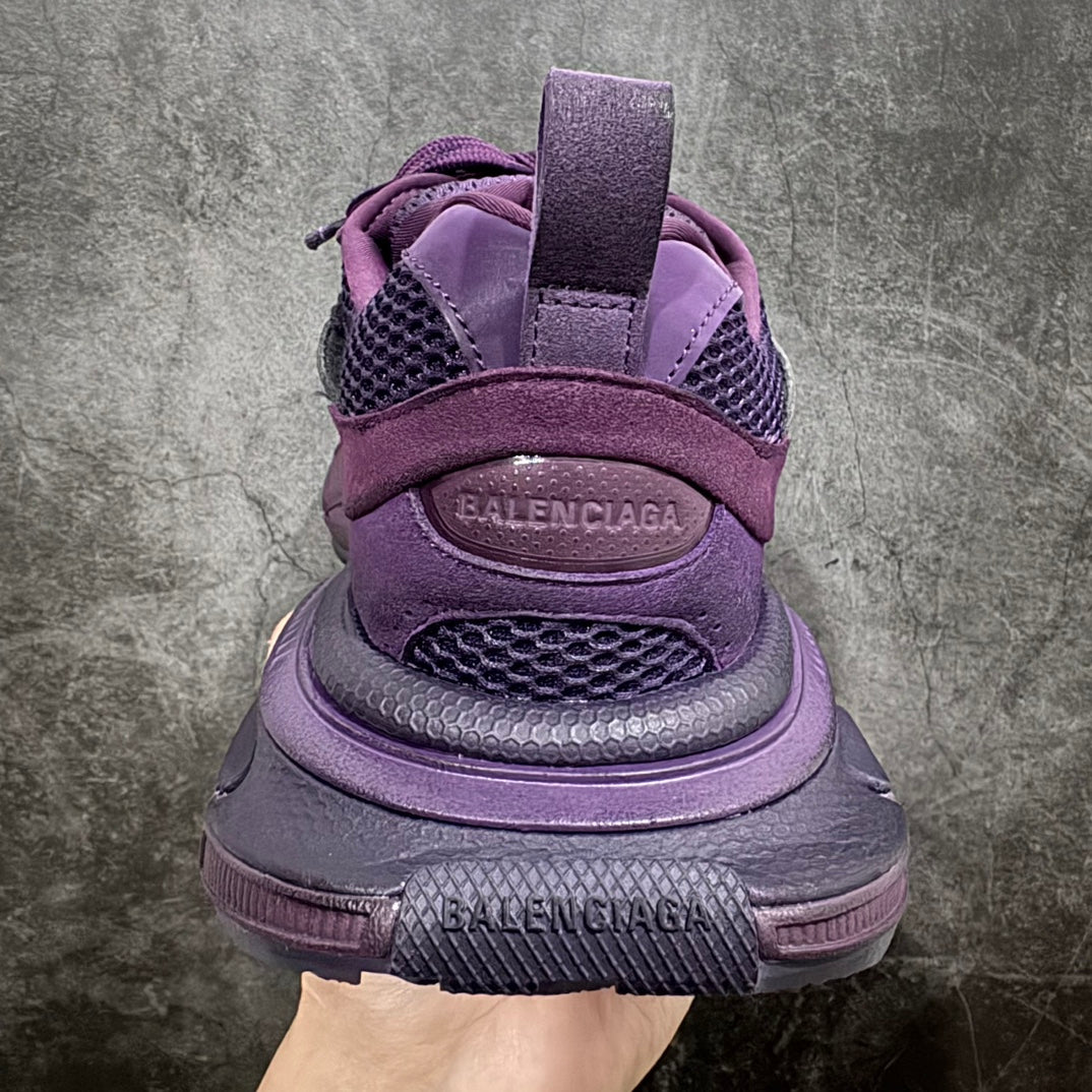 Purple sneakers with lace-up closure, padded heel, and Balenciaga logo on back