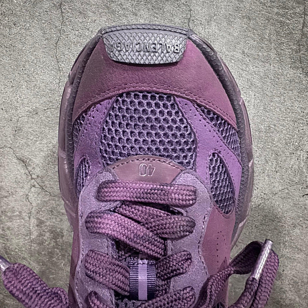 Purple sneakers close-up of laces and textured mesh panel on tongue