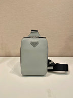 Prada mini crossbody bag, light gray front panel with top handle and black strap