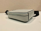 Prada mini bag, light gray side profile with silver zipper and black strap