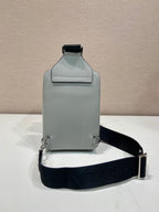 Prada mini crossbody bag, light gray back with top tab and adjustable black strap