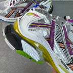 Balenciaga unisex sneakers close-up of heel and side: white leather, purple strip, yellow sole