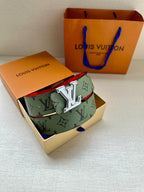 Louis Vuitton belt in box with green monogram strap and silver-tone LV buckle
