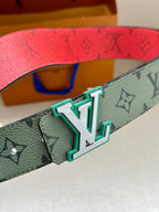 Louis Vuitton belt buckle close-up on green monogram strap with teal frame details