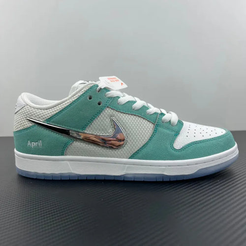 Low-top skate sneakers with white mesh upper and teal leather overlays, silver Swoosh