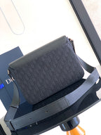 Dark crossbody bag with front flap and patterned canvas, with shoulder strap