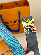 Louis Vuitton belt end view: dark monogram strap with turquoise dots and colorful buckle charm.