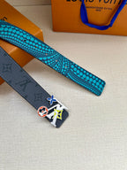 Louis Vuitton belt strap with turquoise dotted underside and dark end with colorful buckle emblem.