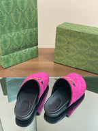 Pink velvet slide sandals with open black interior, gold horsebit detail