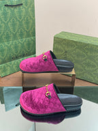 Pink velvet slide sandals on box, gold ring-buckle hardware, black footbed