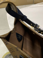 Louis Vuitton monogram handbag base with navy handle strap and interior label