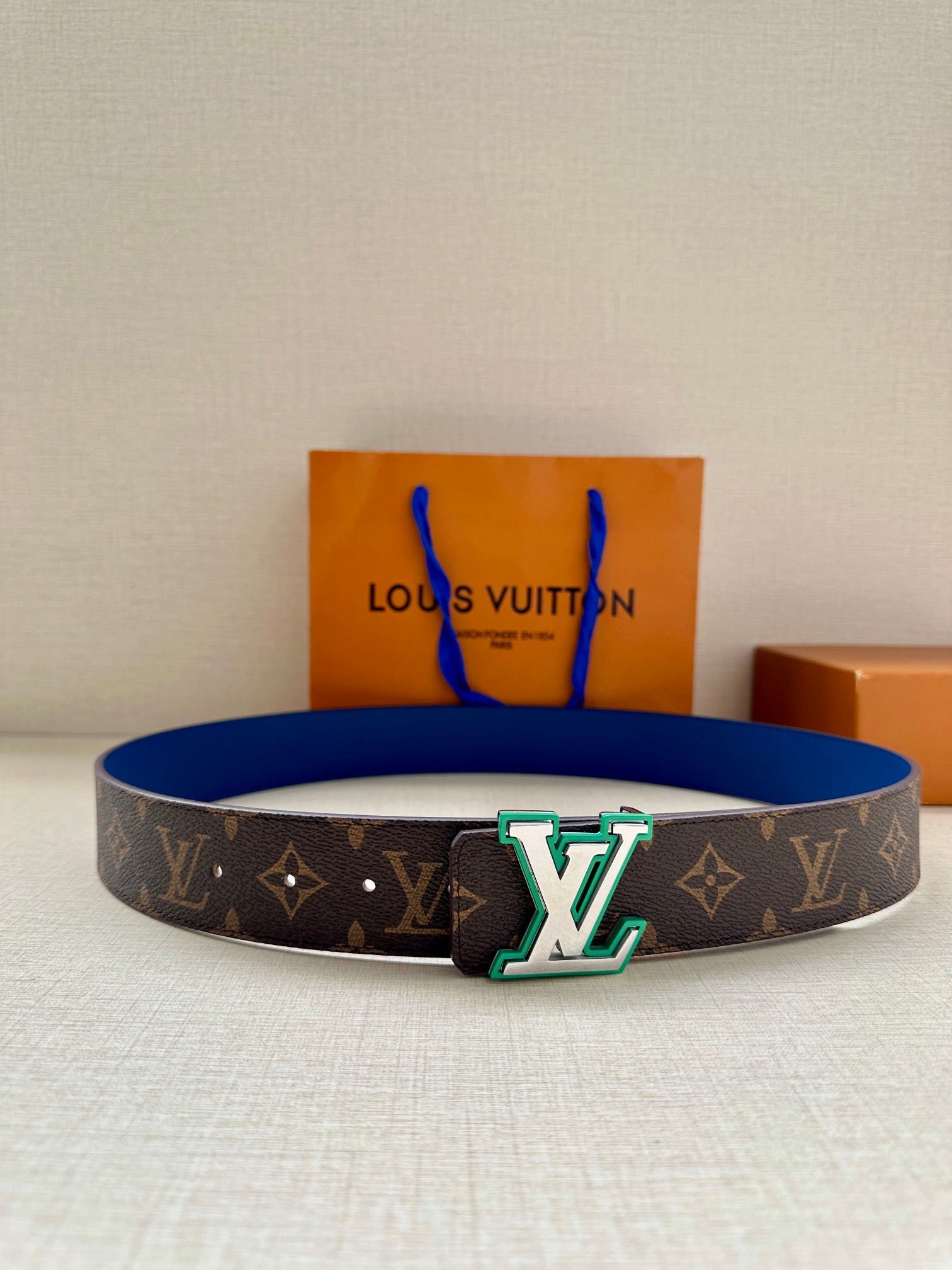 Louis Vuitton monogram belt with dark canvas and blue leather strap, silver LV buckle