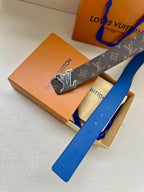 Louis Vuitton belt and buckle detail with dark monogram canvas and blue leather strap