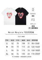 T-shirt size chart with white and black heart-print options