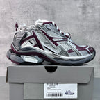 Unisex chunky lace-up sneakers by Balenciaga in white, maroon, and light gray.