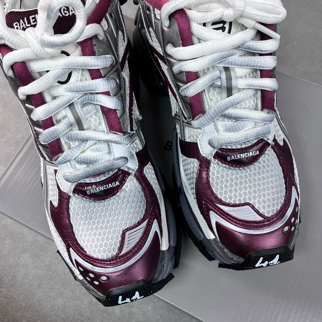 Unisex Balenciaga sneakers side view with white laces and maroon-and-gray panels.