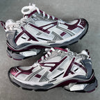Unisex chunky lace-up sneakers by Balenciaga in white and maroon with gray details.
