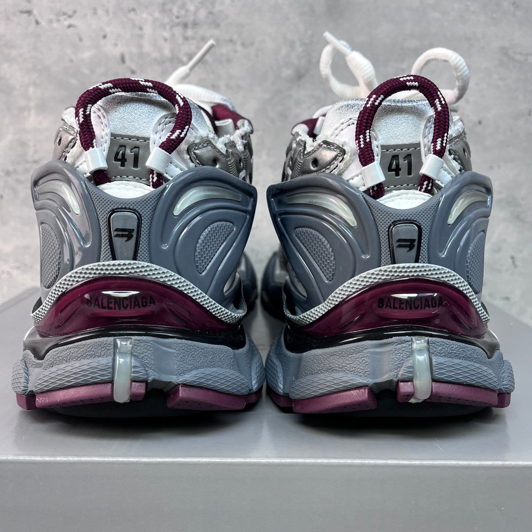 Unisex Balenciaga sneakers heel view with raised back panels and maroon accents.