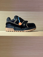 Louis Vuitton trainer shoes in black with blue trim, logo straps, and gum outsole