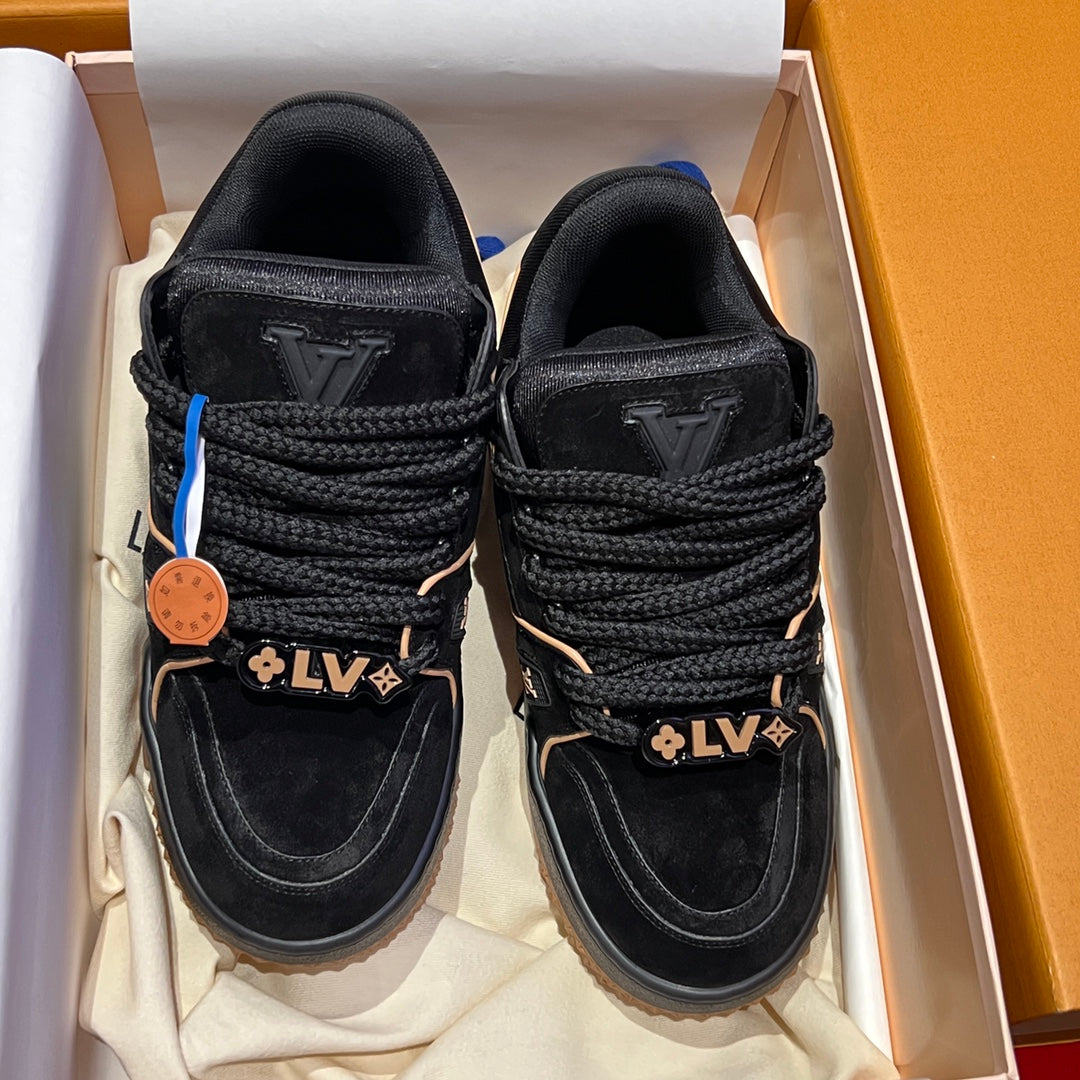 Louis Vuitton trainer shoes, black uppers with LV logo tags, lace eyelets, and tread sole