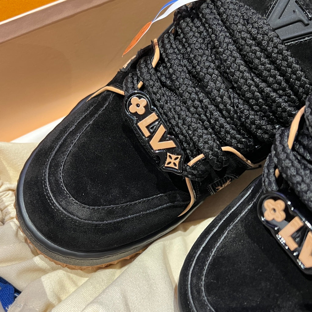 Louis Vuitton trainer shoes close-up, black knit collar with LV monogram patch