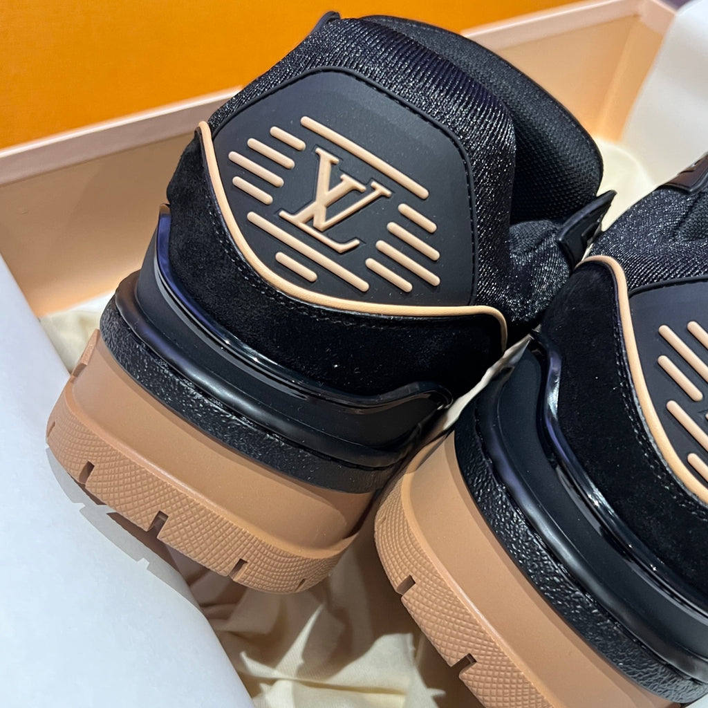 Louis Vuitton trainer shoes heel view, black upper with LV emblem and tan rubber sole