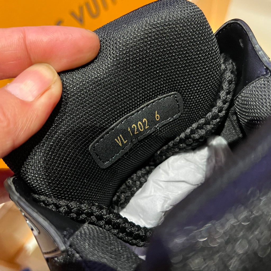 Louis Vuitton trainer shoe size label on black textured tongue with braided laces