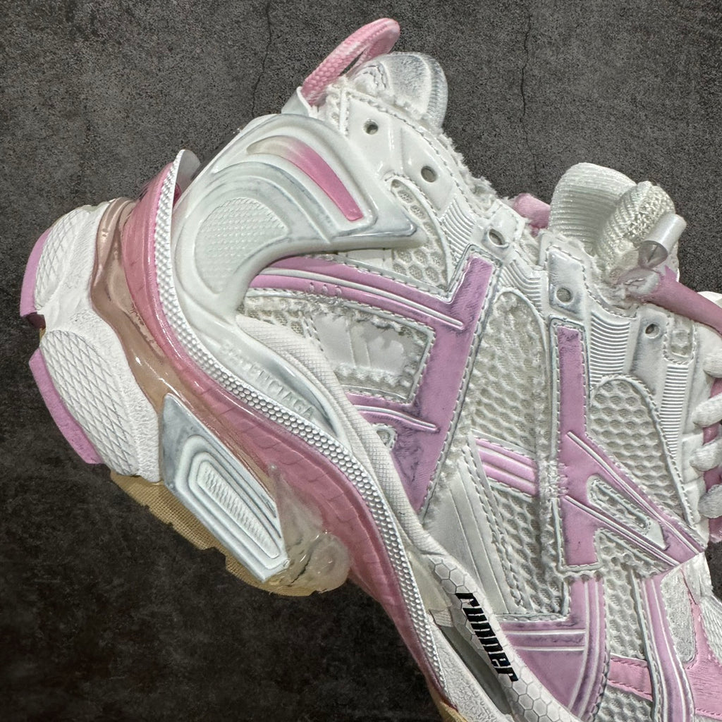 Balenciaga unisex sneaker side view with white upper and pink diagonal stripes