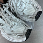 Balenciaga unisex sneakers close-up, light gray knit panels and thick rubber sole