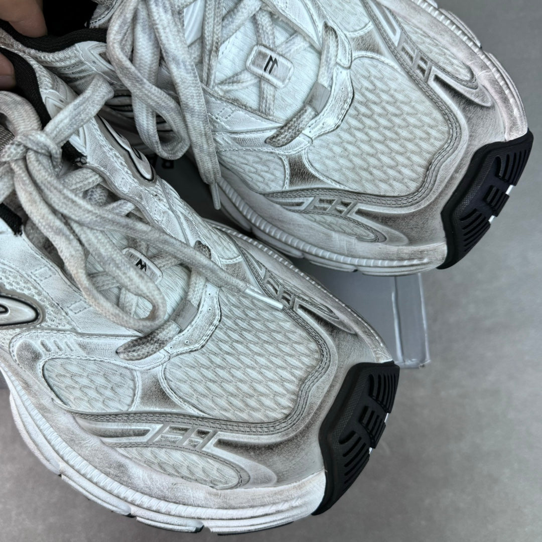 Balenciaga unisex sneakers close-up, light gray knit panels and thick rubber sole
