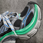 Balenciaga unisex sneaker side detail, green rubber edge with blue piping and laces