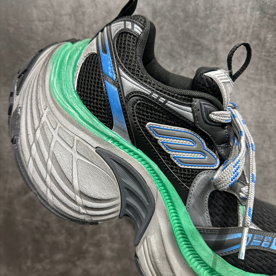 Balenciaga unisex sneaker quarter view, black upper with green midsole and blue logo panel