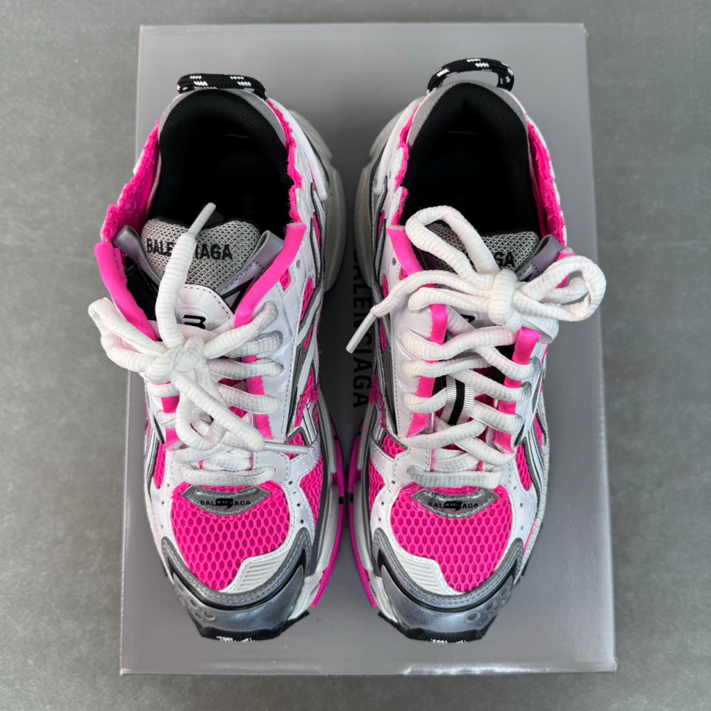 Balenciaga Runner sneakers pair front, white with bright pink panels and black heel details