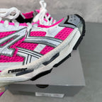 Balenciaga Runner sneakers side close-up, pink mesh panels with white and black trim