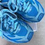 Unisex blue sneaker laces over perforated mesh and stitched panel detail