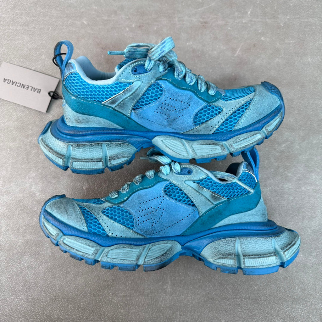 Unisex blue lace-up sneakers pair with perforated panels and chunky sole