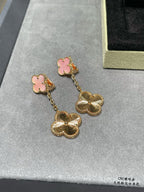 Gold-tone dangle earrings with pink clover studs and scalloped flower charms