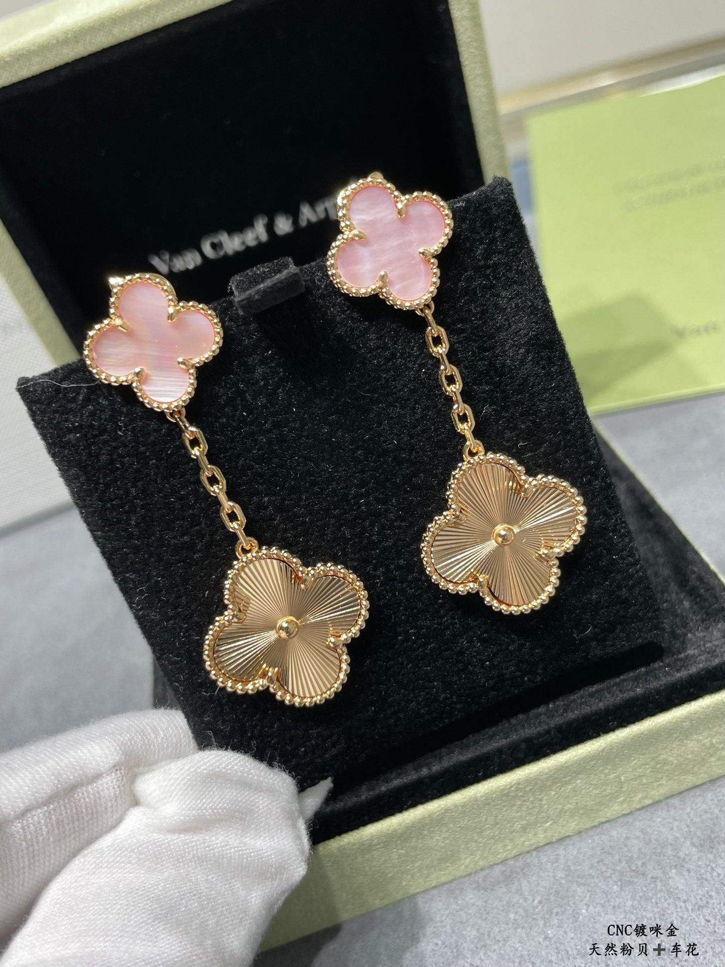 Gold-tone earrings in gift box: pink clover enamel tops with scalloped flower drop charms